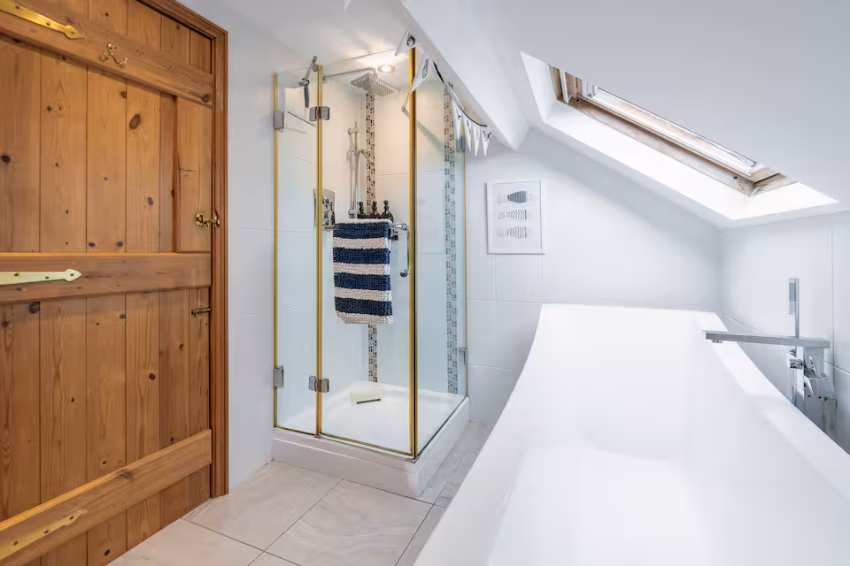 A bath tub and separate shower unit