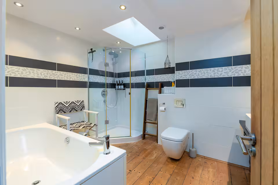 Bathroom with bath tub and separate shower unit