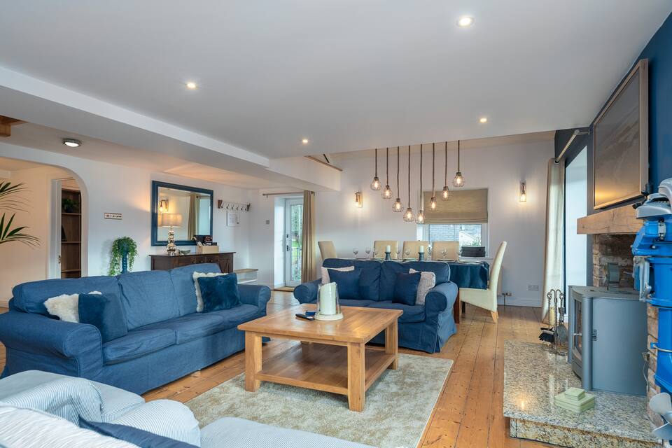 The main living room with seating area and dining area