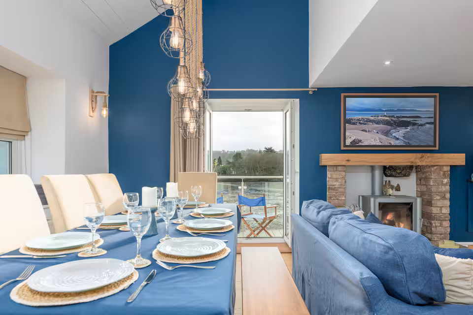 Dining area with views from the patio door over the Menai Straits